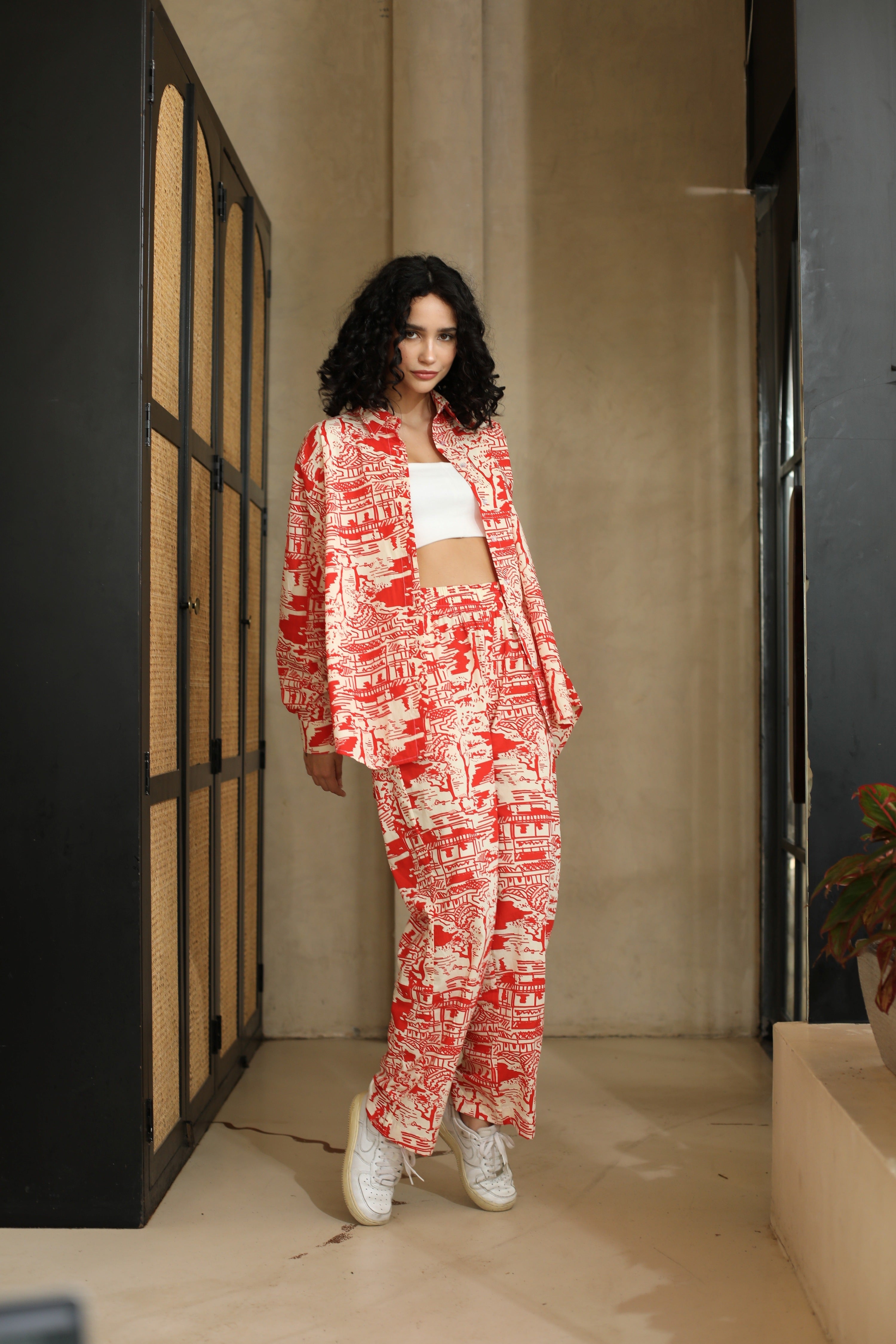 Luxurious Red Romance Trousers by thr3letter with all-over architectural print in vibrant red and cream tones