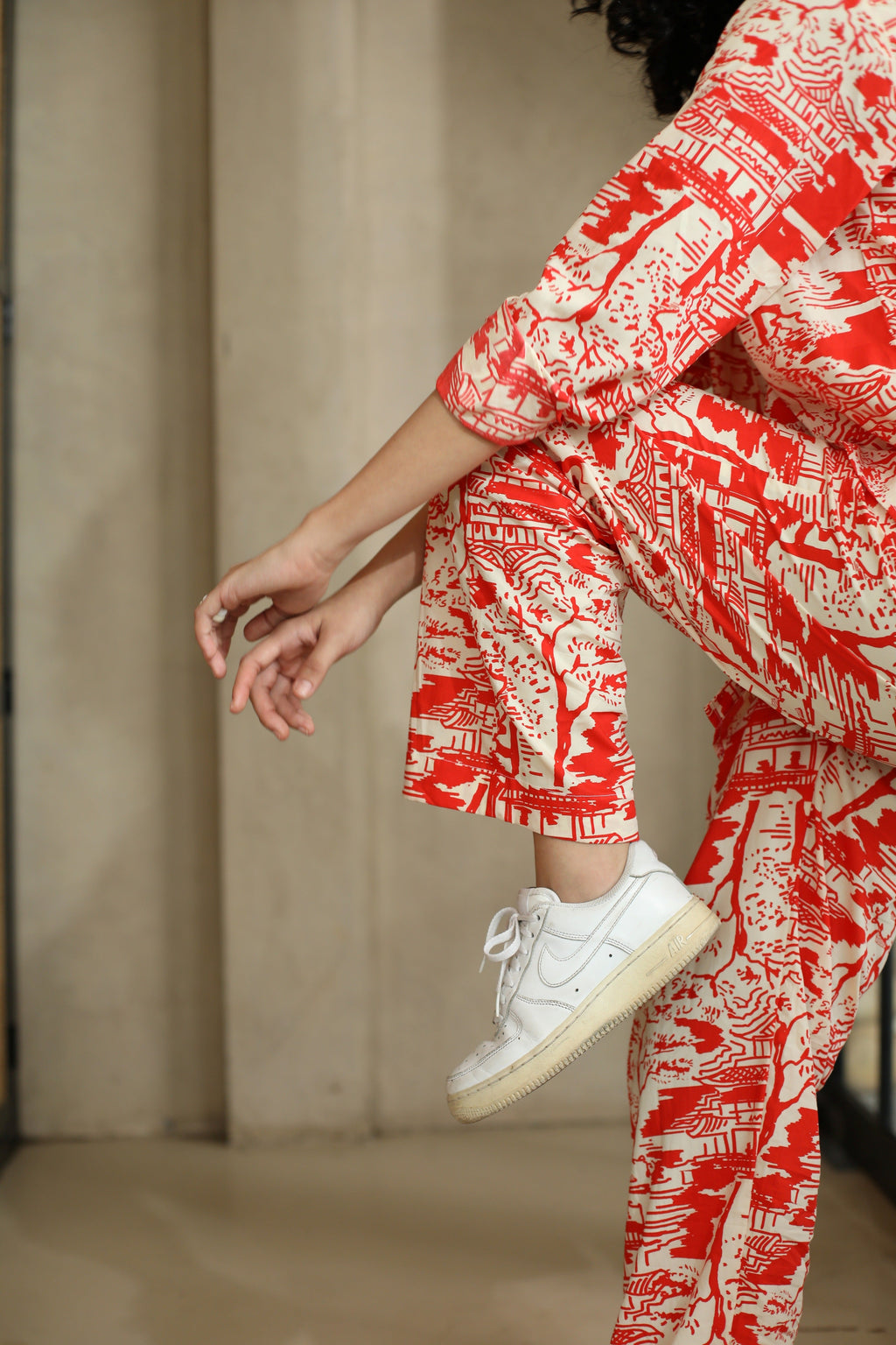 thr3letter's Red Romance Trousers: Statement pants with bold red temple motifs and contemporary street style appeal