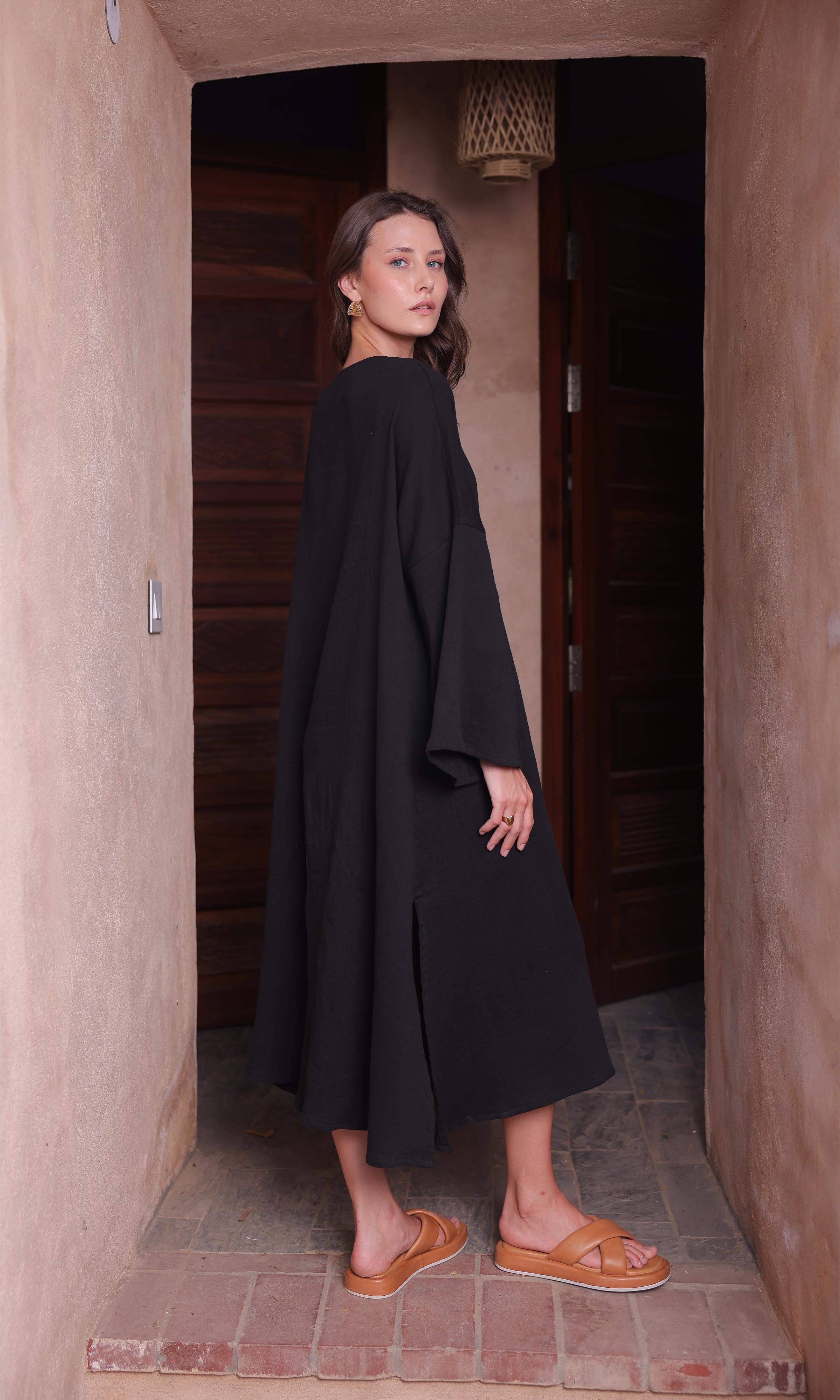 The Kiaan Kaftan from Thr3letter, a comfortable design in a deep black made with seersucker and cotton.