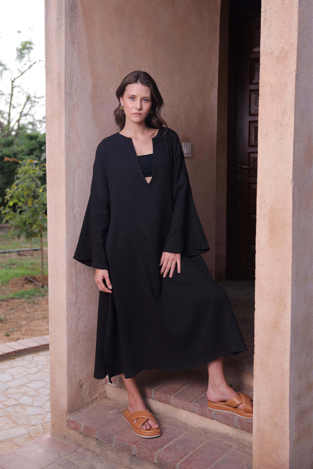 Thr3letter's Kiaan Kaftan in an elegant black color, showcasing its relaxed, flowing silhouette.