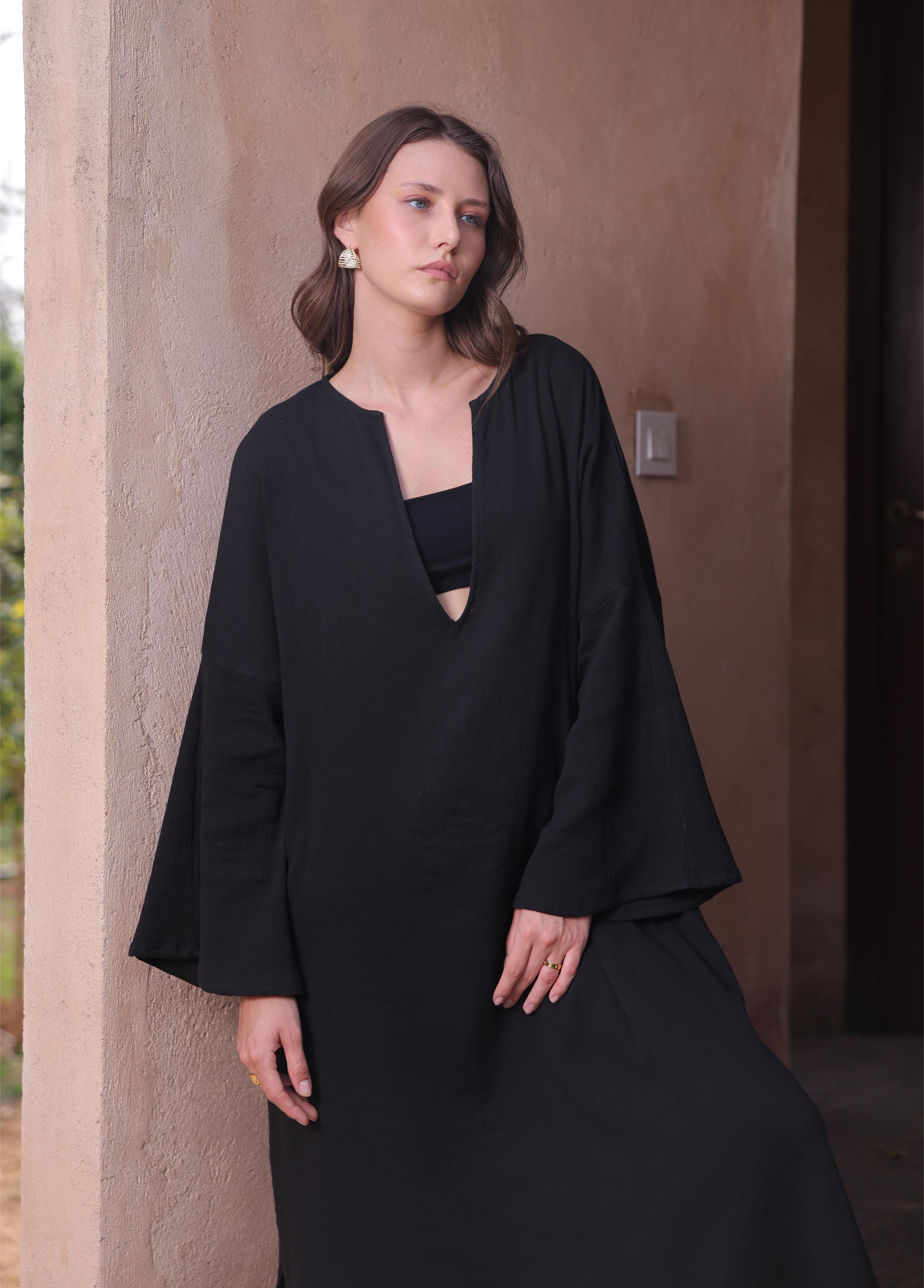 The Kiaan Kaftan by Thr3letter, a seersucker and organic cotton blend in a beautiful black hue.