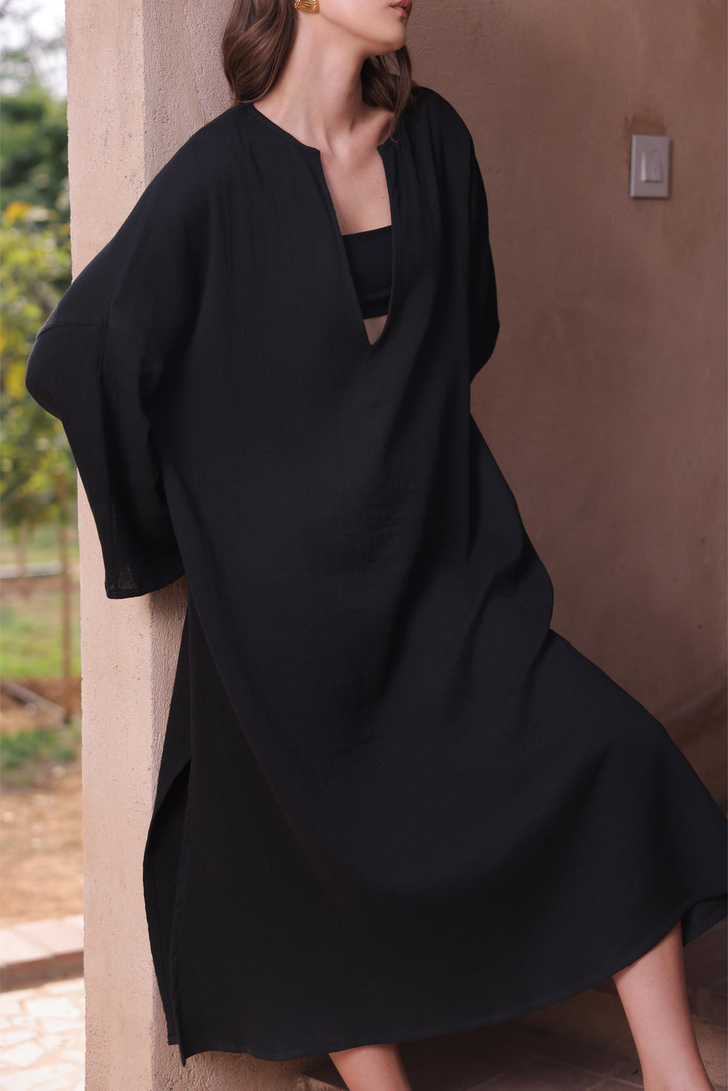 Thr3letter's Kiaan Kaftan in a sleek, regal black color, showcasing its elegant silhouette.