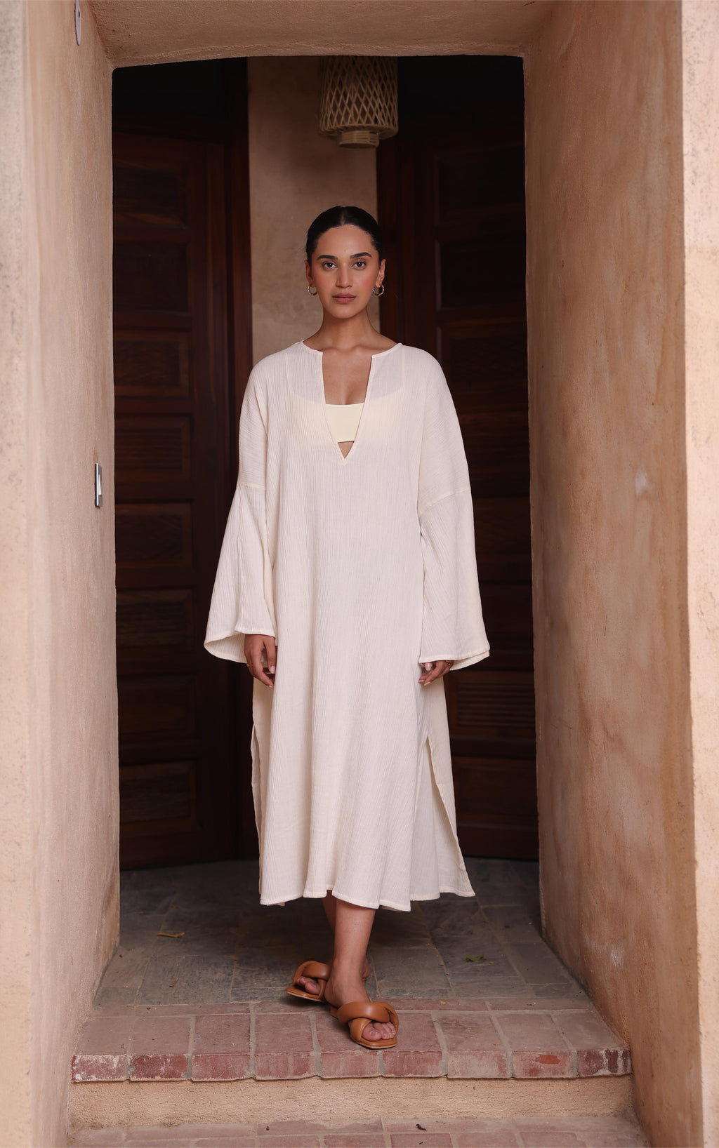 The Kiaan Kaftan by Thr3letter, a comfortable design in a warm almond shade made of seersucker and cotton.