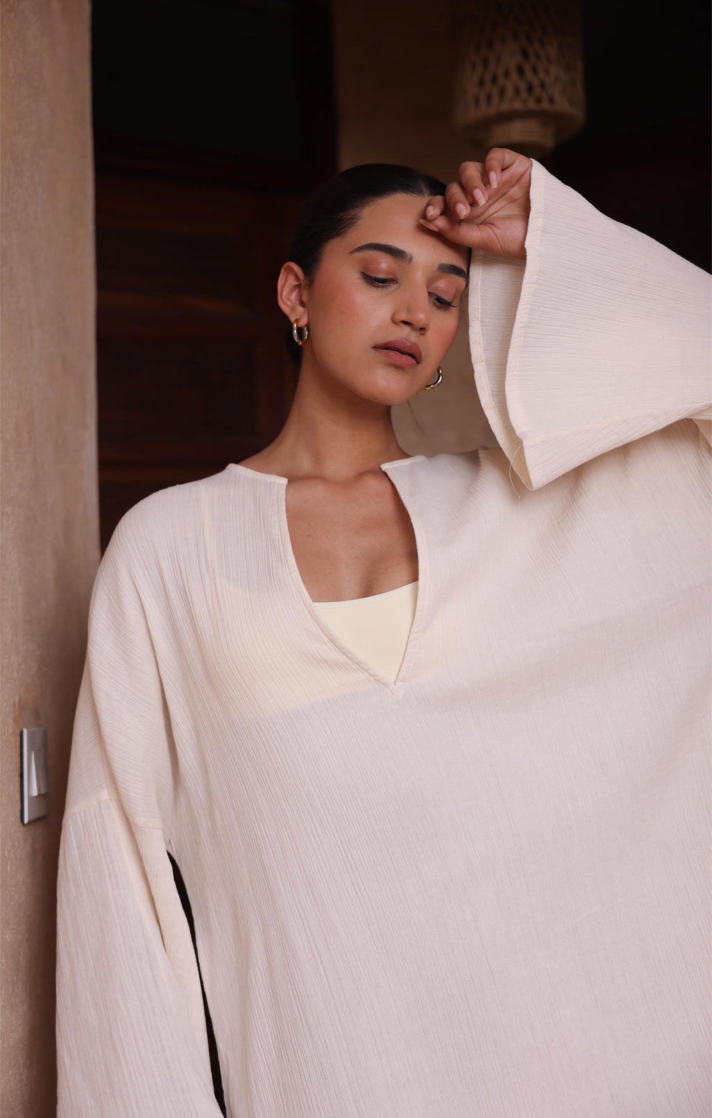 Thr3letter's Kiaan Kaftan in a sophisticated almond color, offering both style and comfort.
