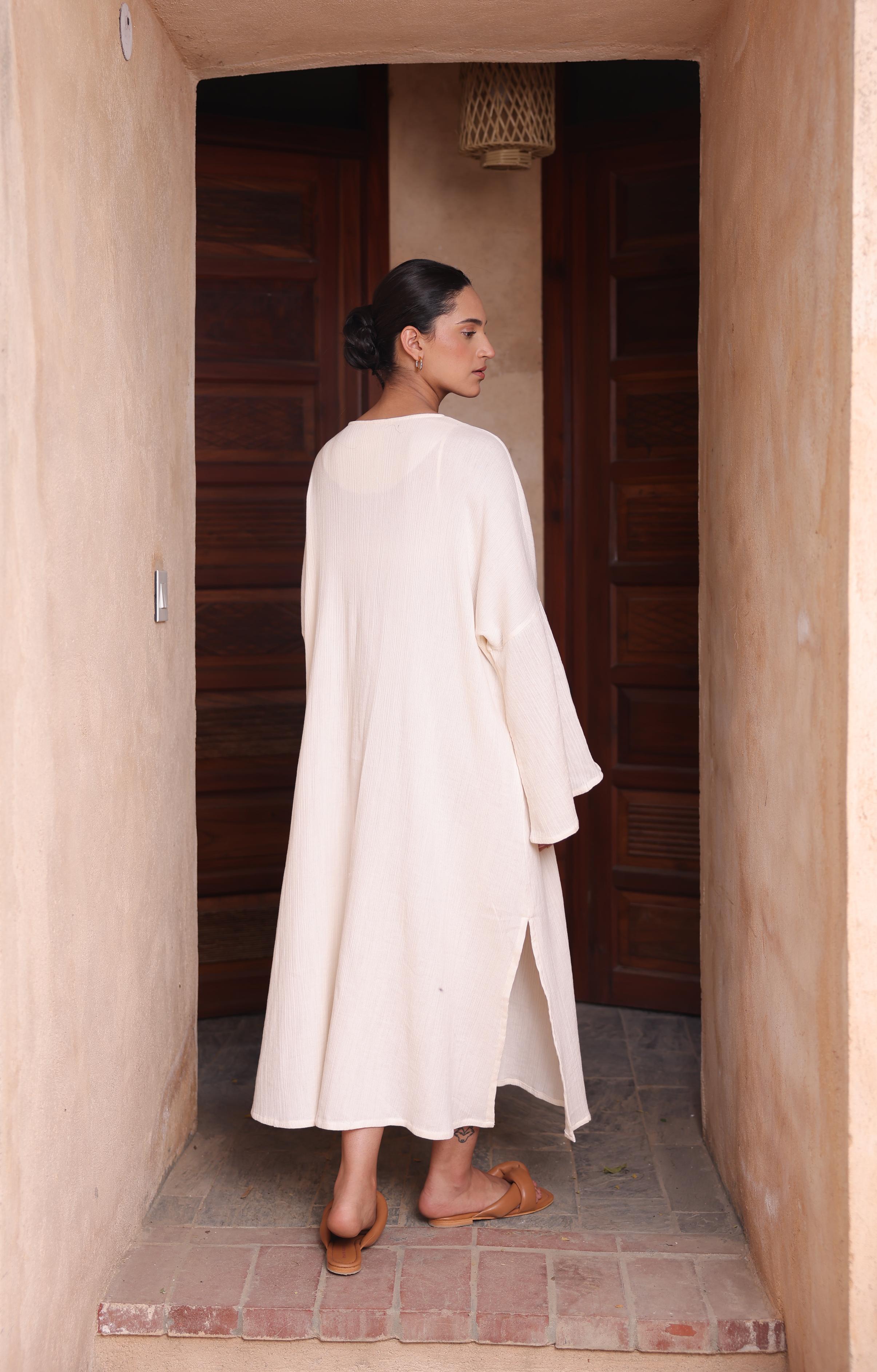 Thr3letter's Kiaan Kaftan in a versatile almond hue, showcasing its relaxed, elegant silhouette.