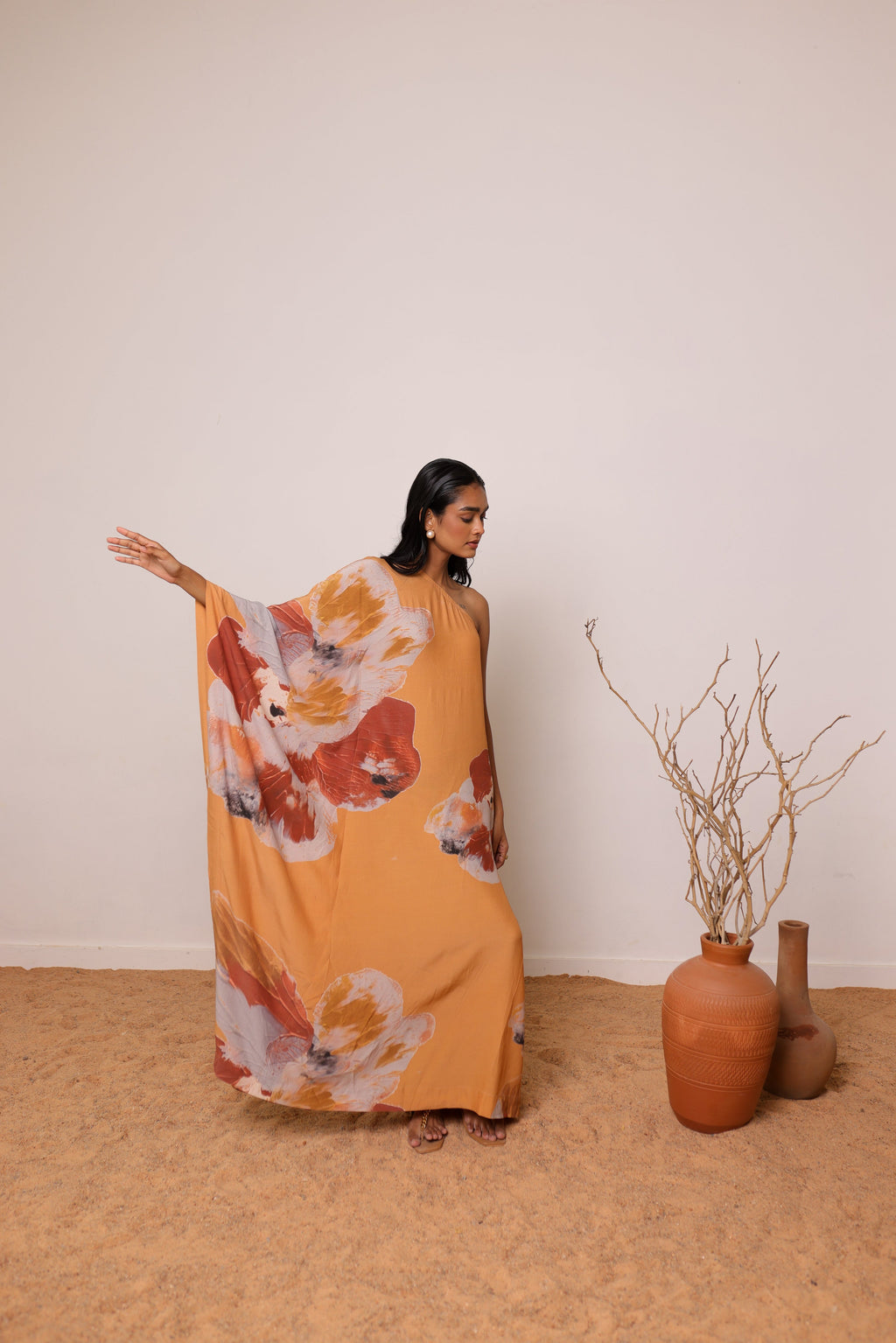 Thr3letter's Lumiere Kaftan: Romantic evening wear crafted from sumptuous silk-crep, creating soft, flattering architectural lines.