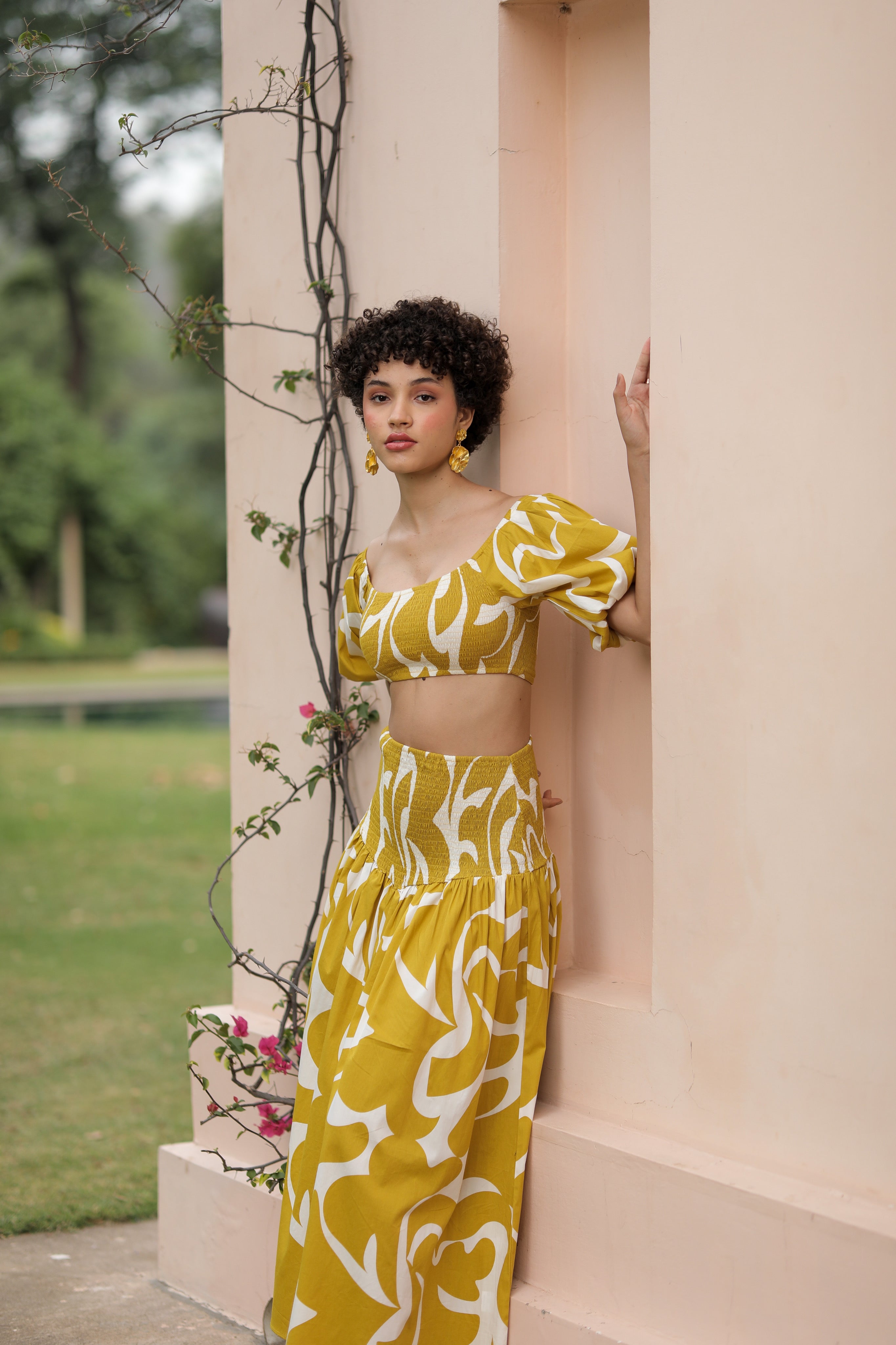Summer-ready thr3letter veronica skirt featuring dramatic maxi length and geometric pattern in marigold