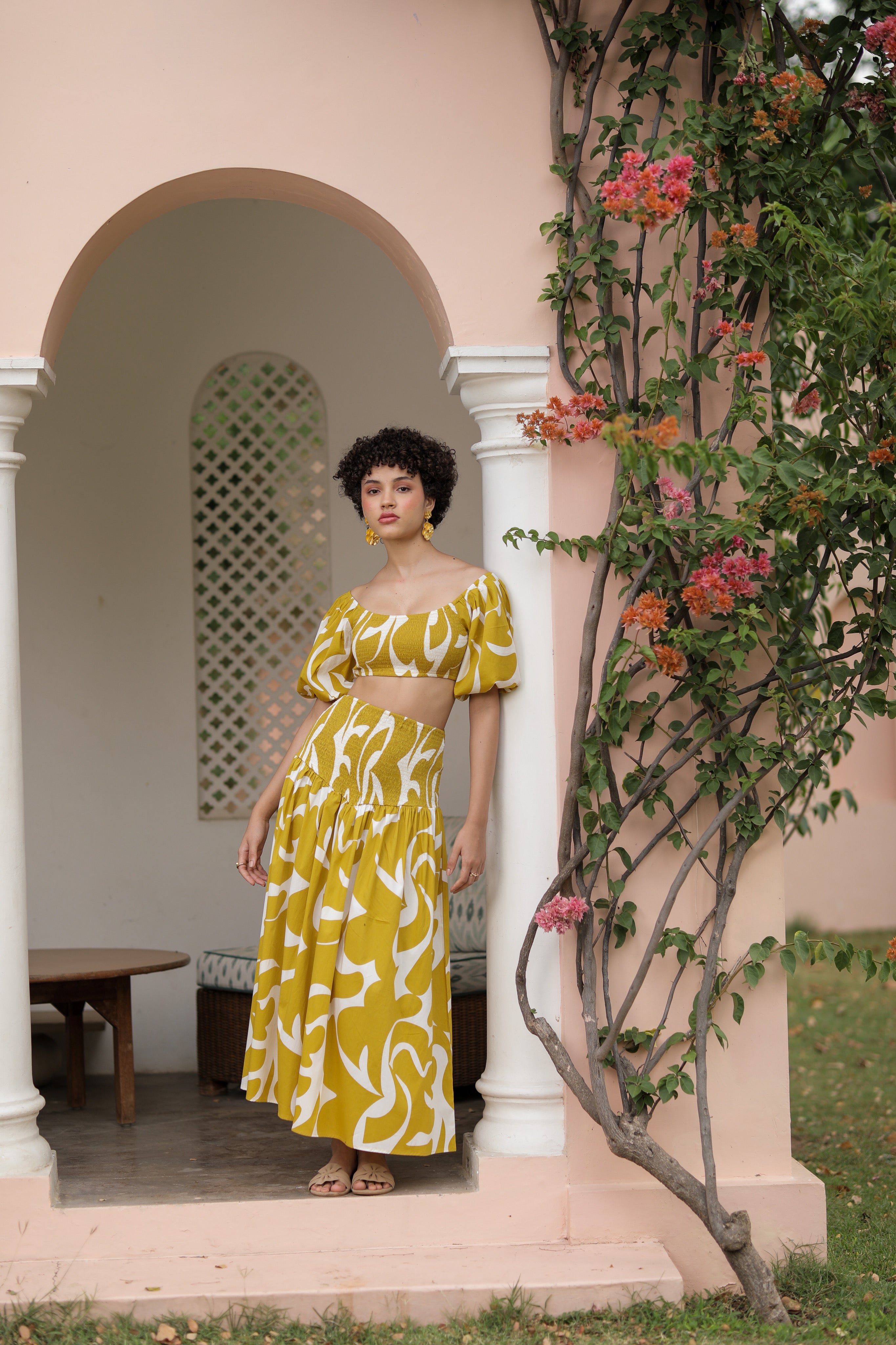 thr3letter veronica skirt in bold mustard yellow with abstract white print, styled as a matching set